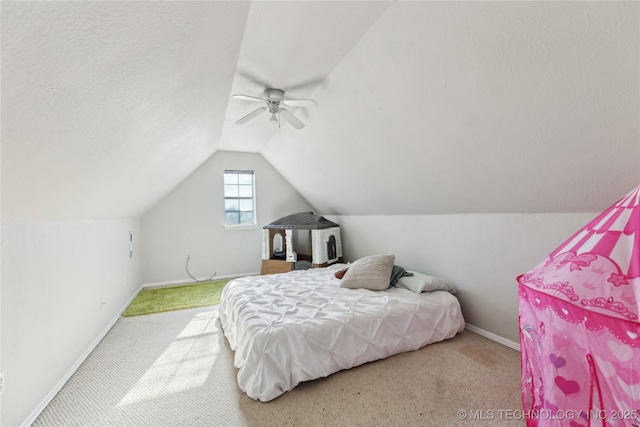 bedroom with carpet flooring, ceiling fan, and vaulted ceiling