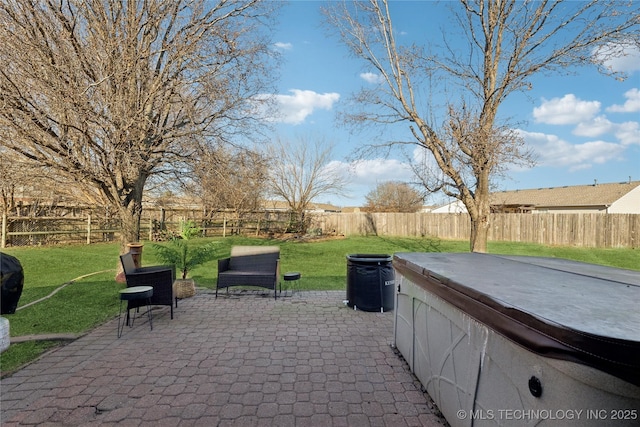 view of patio / terrace with a hot tub