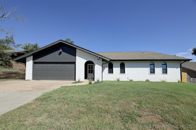 single story home featuring a front yard and a garage