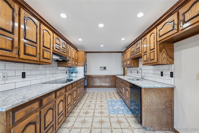 kitchen with black appliances, light stone countertops, sink, and ornamental molding