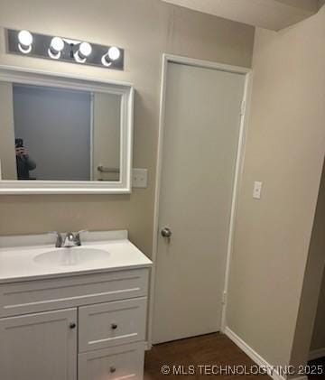 bathroom featuring wood-type flooring and vanity