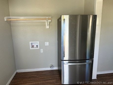 laundry area with dark wood-type flooring and washer hookup