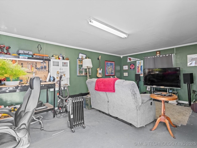 living room featuring ornamental molding and concrete floors