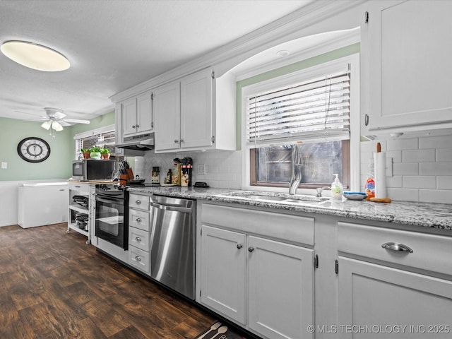 kitchen featuring white cabinetry, sink, ceiling fan, stainless steel appliances, and tasteful backsplash