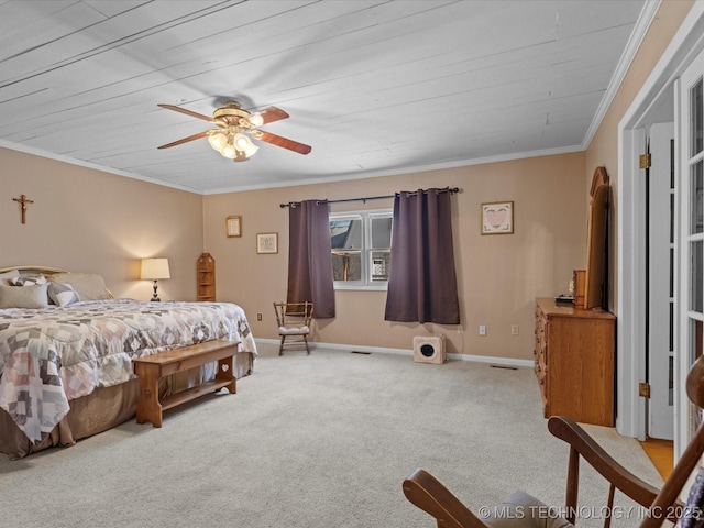 bedroom featuring ceiling fan, crown molding, light carpet, and wooden ceiling