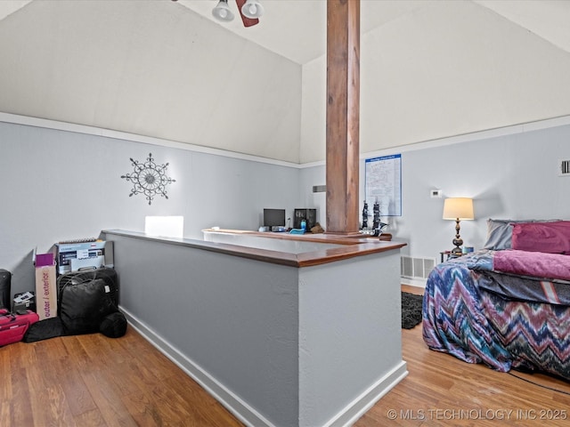 office featuring light wood-type flooring and vaulted ceiling