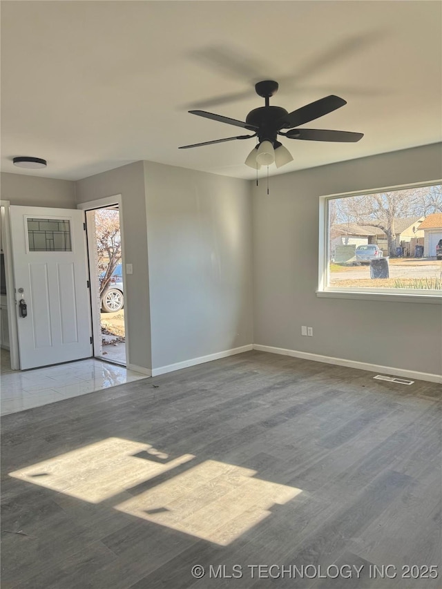 interior space featuring ceiling fan and wood-type flooring