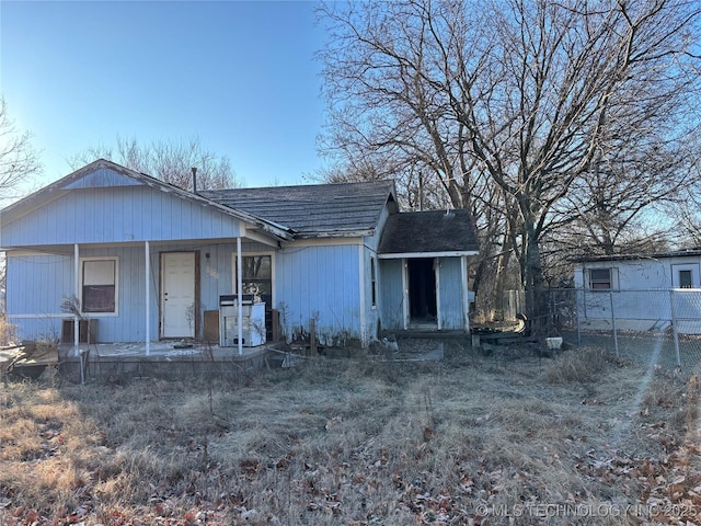 rear view of property with a porch