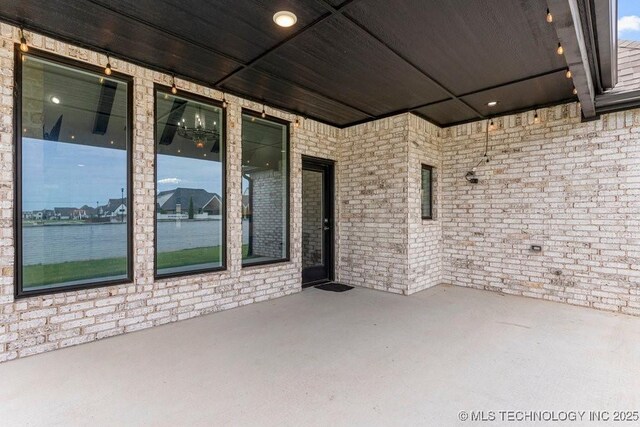 view of patio / terrace with a water view