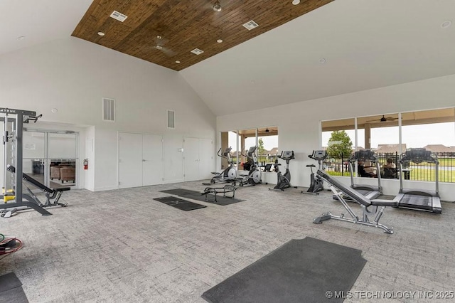 workout area with carpet floors, high vaulted ceiling, and wood ceiling