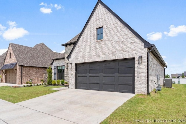 view of front of house featuring a front yard, a garage, and cooling unit