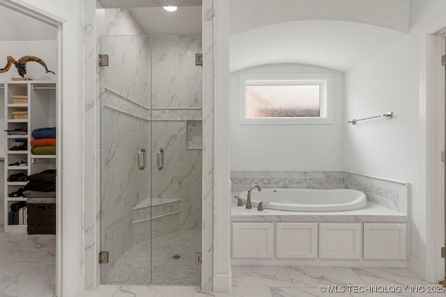 bathroom featuring plus walk in shower