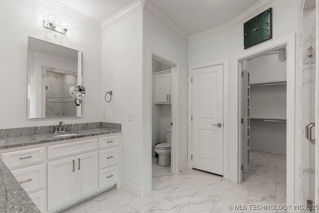 bathroom featuring walk in shower, crown molding, vanity, and toilet