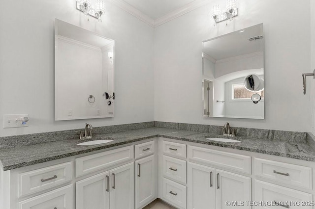 bathroom with vanity and ornamental molding