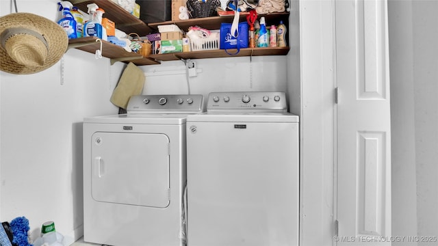 laundry area with washing machine and clothes dryer