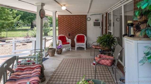 sunroom with a wall unit AC