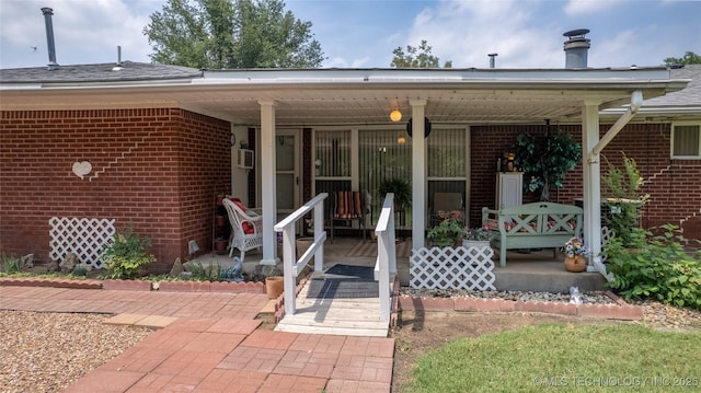 entrance to property featuring a porch