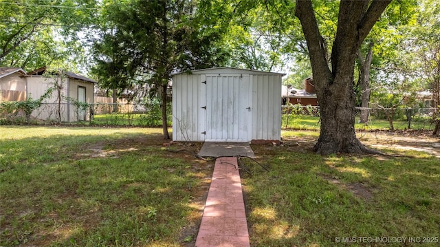 view of outbuilding featuring a yard