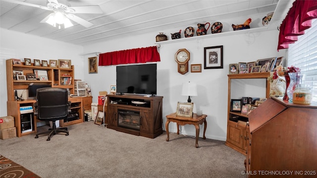 carpeted office featuring ceiling fan