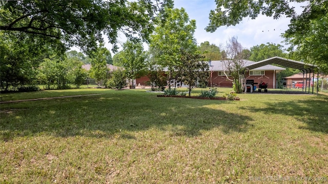 view of yard featuring a carport