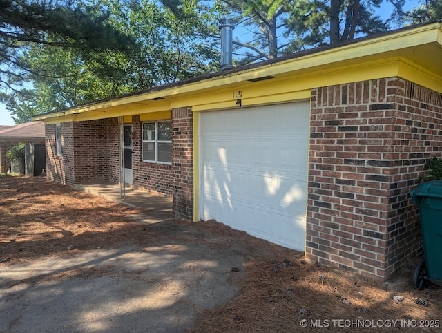 view of side of property with a garage