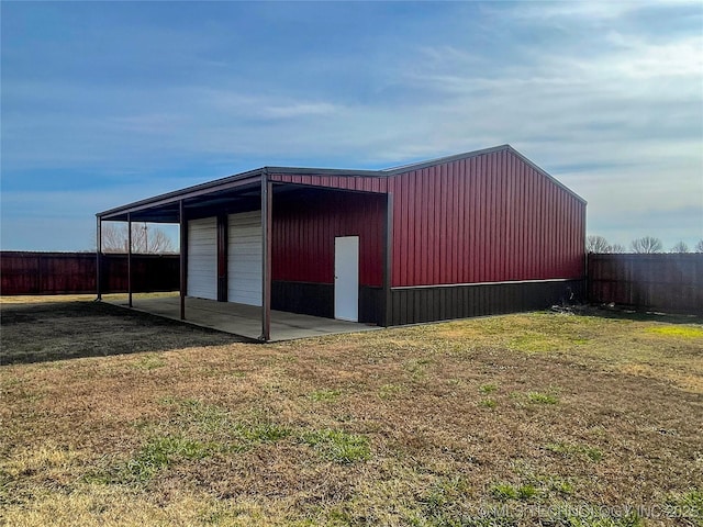 view of outbuilding with a yard