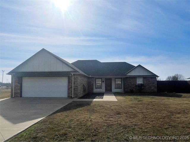 single story home with a front yard and a garage