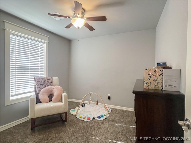 recreation room with ceiling fan and carpet floors