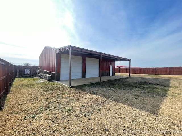 view of outbuilding featuring a yard