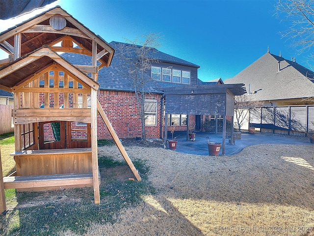 view of play area with a patio