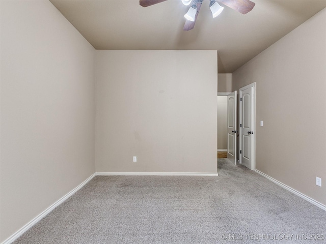 spare room with light carpet and ceiling fan