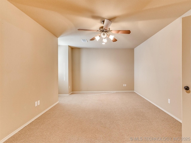 unfurnished room with carpet flooring and ceiling fan