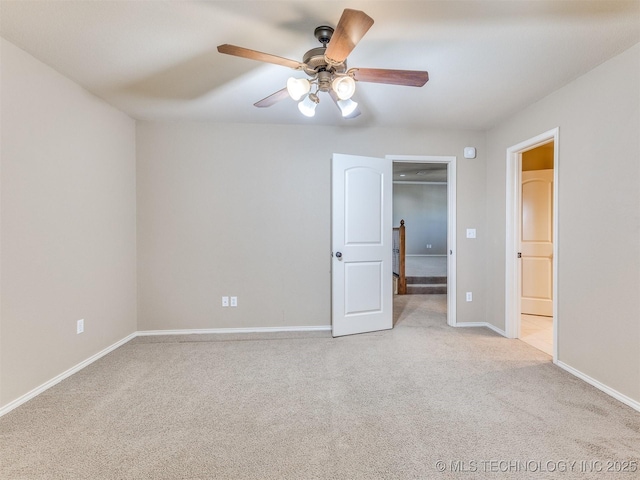 unfurnished bedroom with ceiling fan and light colored carpet