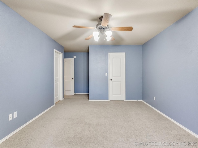 unfurnished bedroom with ceiling fan and light colored carpet