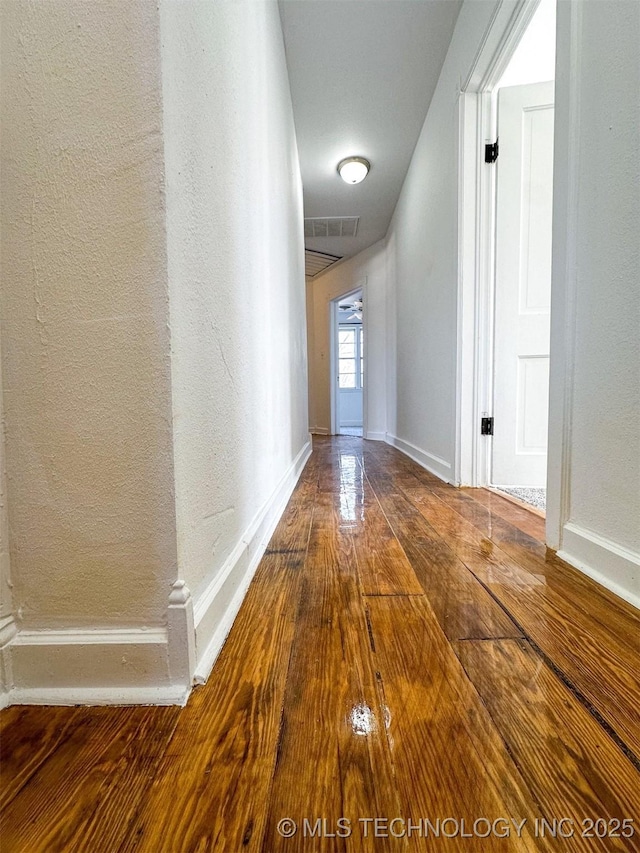 hallway featuring wood-type flooring