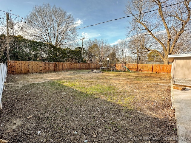 view of yard featuring a trampoline