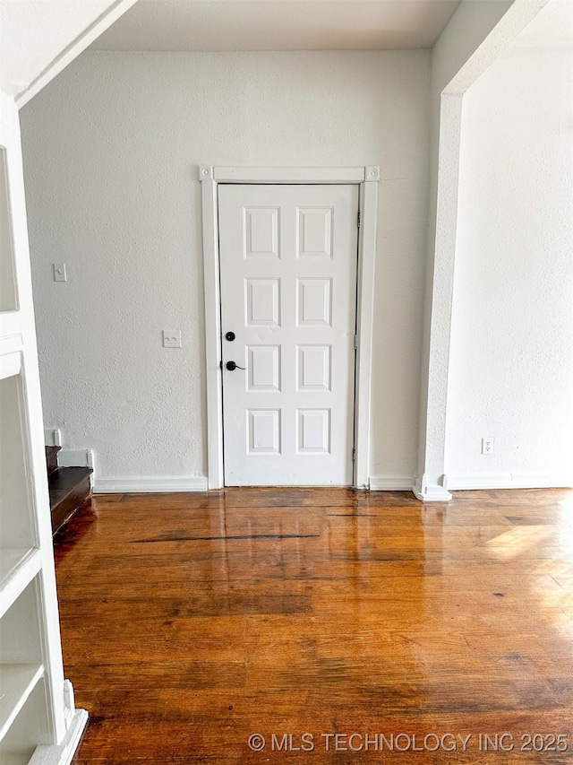 foyer entrance with hardwood / wood-style flooring