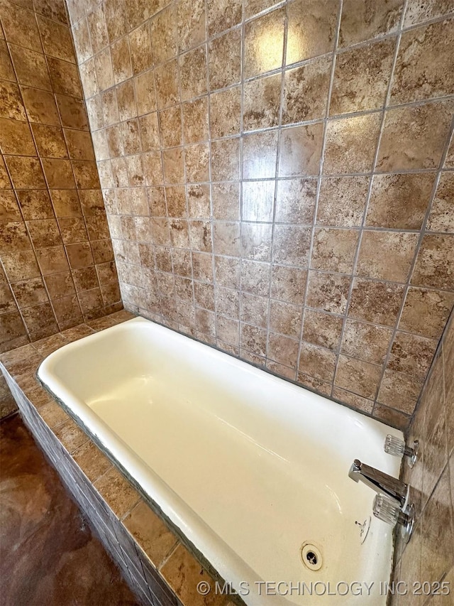 bathroom with tiled bath