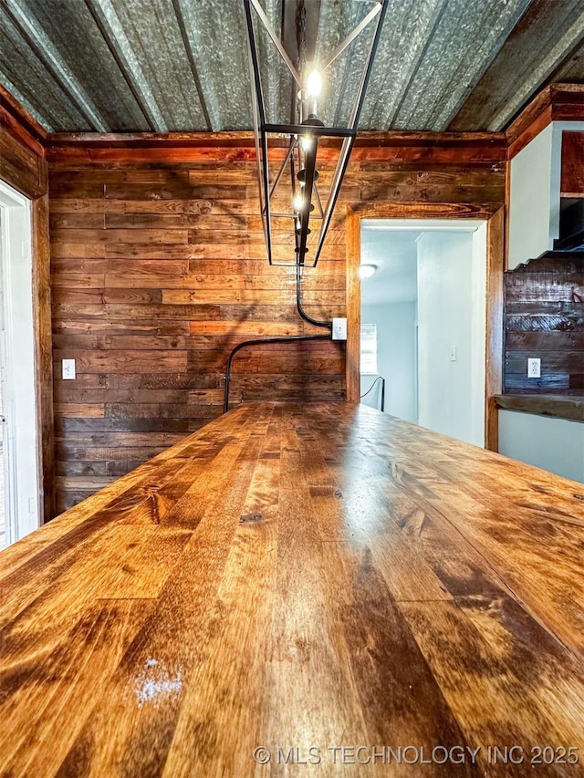 interior space featuring wooden walls