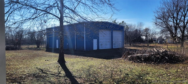 view of outbuilding featuring a garage