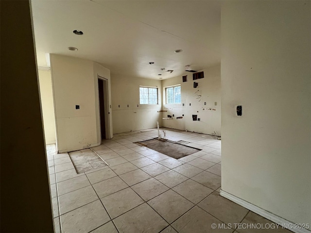 spare room with light tile patterned floors