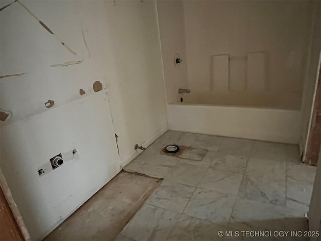 bathroom featuring a tub to relax in