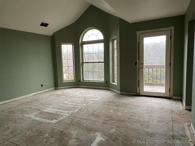 empty room with vaulted ceiling