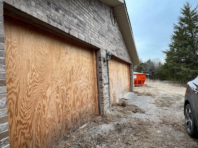 view of side of home with a garage