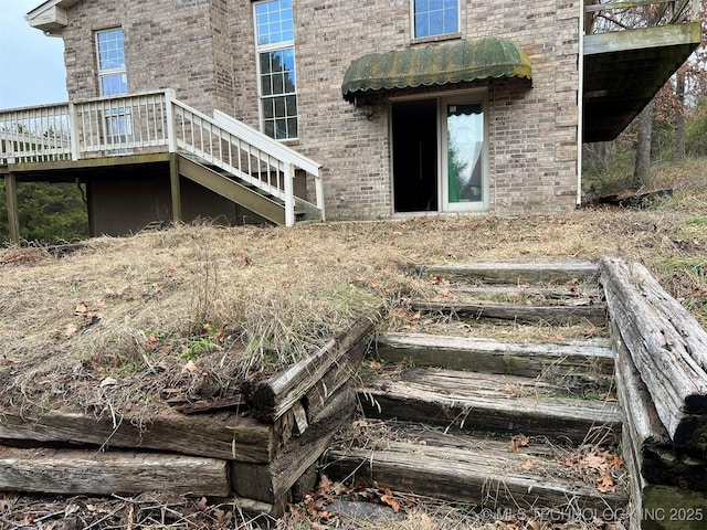 entrance to property featuring a deck