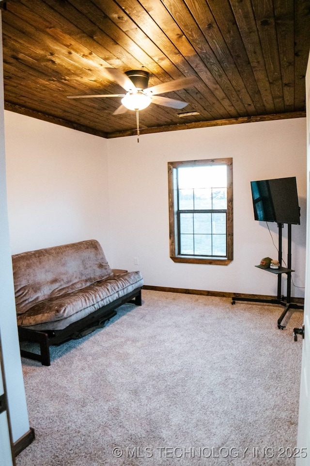 unfurnished room featuring carpet flooring, ceiling fan, and wooden ceiling