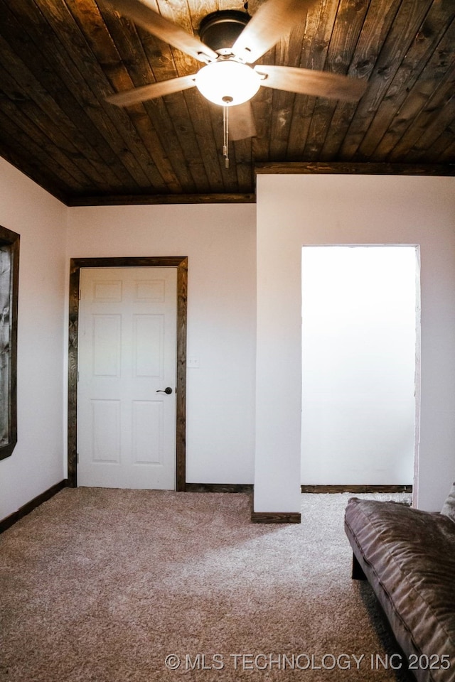 unfurnished bedroom with carpet, ceiling fan, and crown molding