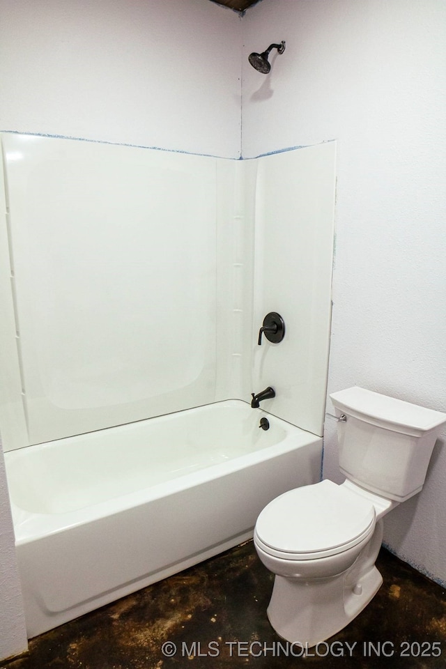 bathroom with toilet and shower / washtub combination