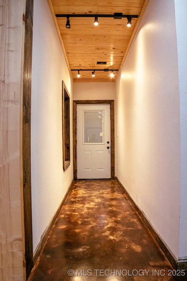 hallway with wooden ceiling and rail lighting