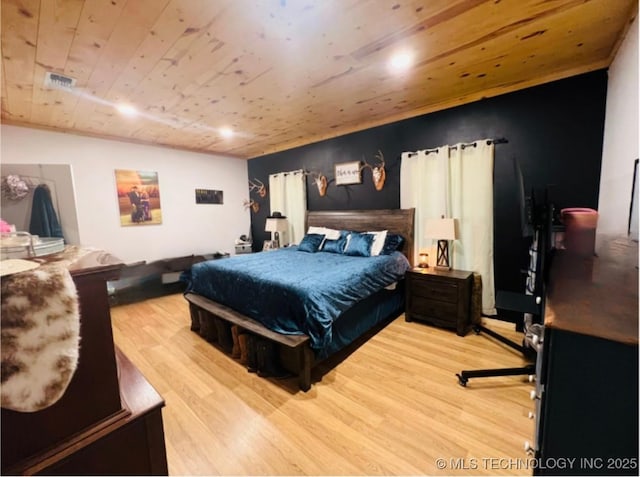 bedroom featuring wood ceiling and light hardwood / wood-style flooring